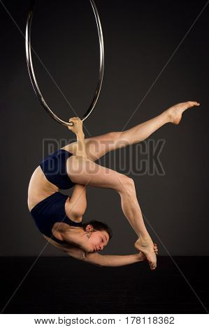 Woman Exercising On Lyra