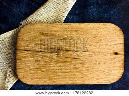 Rural kitchen board  on  old  cloth from above - grunge background with free text space. concrete background.  Different stuff. Top view.