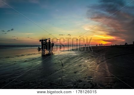 Sunset and silhouette at Parangtritis Beach, Central Java Indonesia