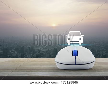 Car flat icon with wireless computer mouse over modern city tower at sunset vintage style Internet transportation service concept