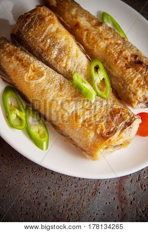 fried shad with chilli australian fish on plate
