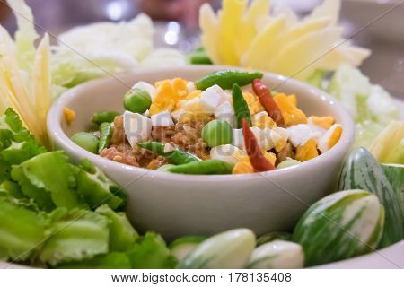 Naam Prik Long Rau chilli dip with pork and egg yolk Thai cuisine