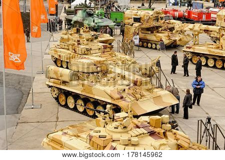Nizhniy Tagil, Russia - September 25. 2013: Visitors explore military equipment on exhibition range. RAE-2013 exhibition.