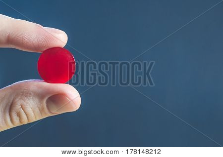 Lollipop Pill For Medicine In Fingers Close Up