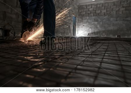 Work of electric saw for metal shot in studio being repaired sparks all around worker