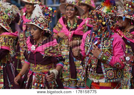 ORURO, BOLIVIA - FEBRUARY 25, 2017: Tinkus dancers in colourful costumes performing at the annual Oruro Carnival. The event is designated by UNESCO as being Intangible Cultural Heritage of Humanity.