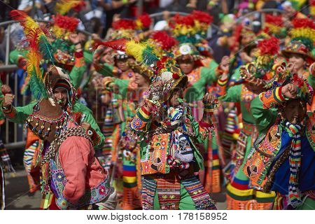 ORURO, BOLIVIA - FEBRUARY 25, 2017: Tinkus dancers in colourful costumes performing at the annual Oruro Carnival. The event is designated by UNESCO as being Intangible Cultural Heritage of Humanity.