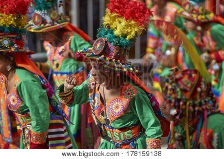 ORURO, BOLIVIA - FEBRUARY 25, 2017: Tinkus dancers in colourful costumes performing at the annual Oruro Carnival. The event is designated by UNESCO as being Intangible Cultural Heritage of Humanity.
