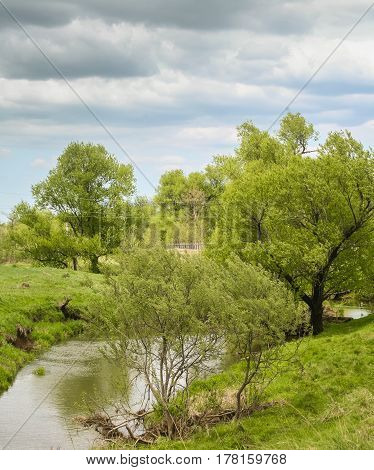 A bright countryside landscape with a river view 4