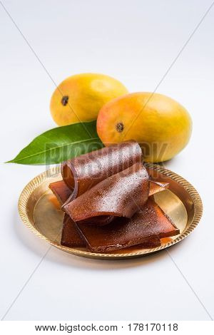 indian alphonso mango's dried jelly called mango papad or mango poli or slab or cake, traditional maharashtrian recipe