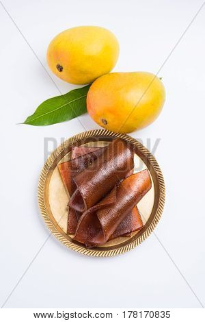indian alphonso mango's dried jelly called mango papad or mango poli or slab or cake, traditional maharashtrian recipe