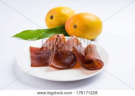 indian alphonso mango's dried jelly called mango papad or mango poli or slab or cake, traditional maharashtrian recipe
