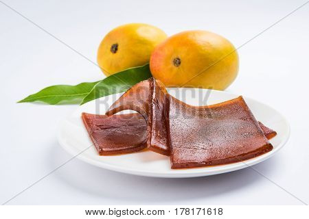 indian alphonso mango's dried jelly called mango papad or mango poli or slab or cake, traditional maharashtrian recipe