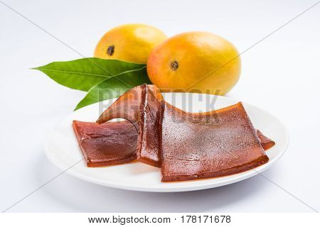 indian alphonso mango's dried jelly called mango papad or mango poli or slab or cake, traditional maharashtrian recipe