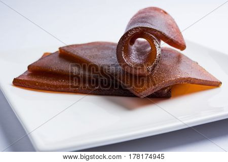 indian alphonso mango's dried jelly called mango papad or mango poli or slab or cake, traditional maharashtrian recipe