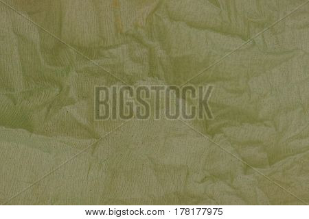 Dark gray background of a roll of crumpled paper