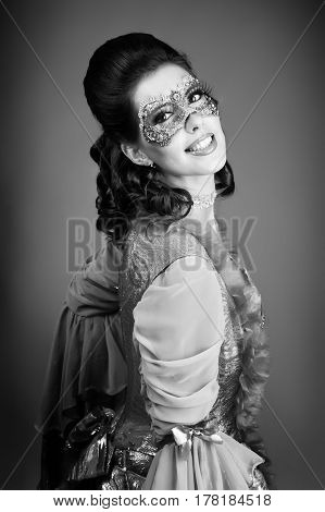 Black and white studio portrait of a young cute girl