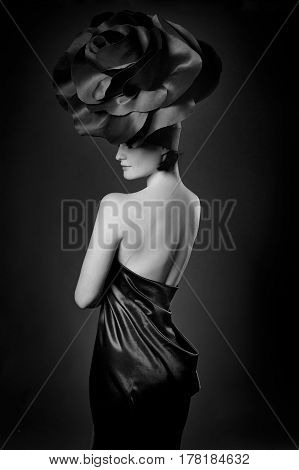 black and white portrait of a girl in a dark roses suit