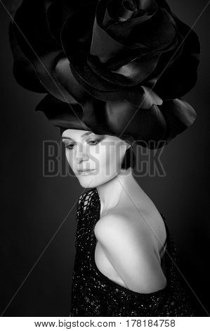 black and white portrait of a girl in a dark roses suit