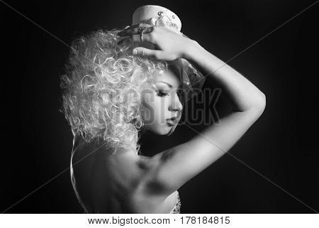 black and white portrait of a sensual girl in a hat with a veil