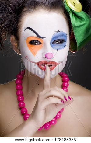 studio portrait of a young cute mime