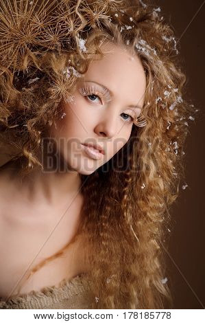 portrait of beautiful curly girl on a beige background
