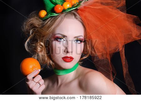 portrait of a girl with fashion makeup on a black background