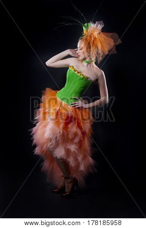 full-length portrait of a girl with fashion makeup on a black background