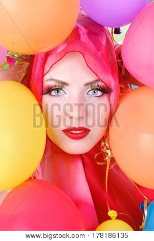 portrait of a girl with fashion makeup and balloons
