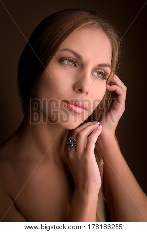 Portrait of beautiful woman on beige background