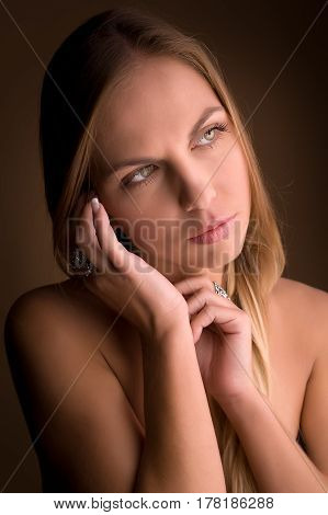 Portrait of beautiful woman on beige background
