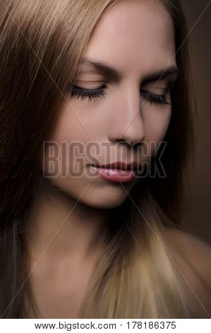 Portrait of beautiful woman on beige background