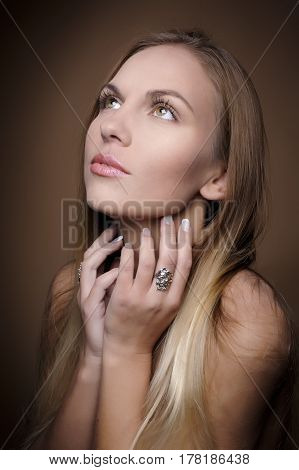 Portrait of beautiful woman on beige background