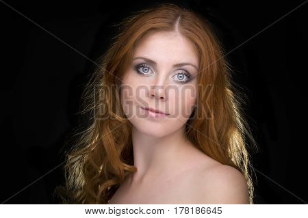 Closeup portrait of a redhead female model