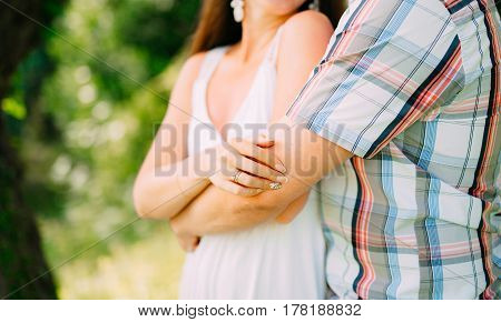 The groom embraces the bride in the forest. Wedding in Montenegro and Croatia.