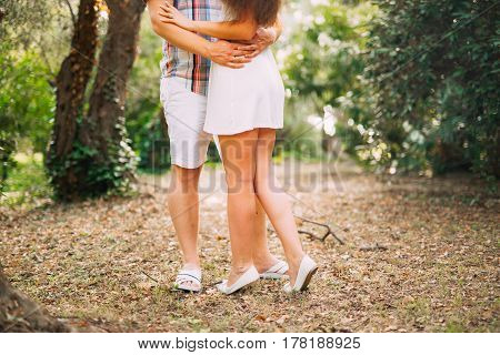 The groom embraces the bride in the forest. Wedding in Montenegro and Croatia.