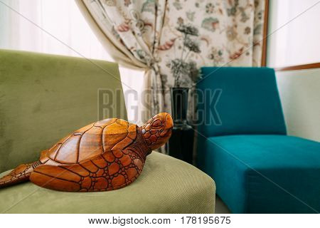 Wooden turtle. Elements of interior design apartments.