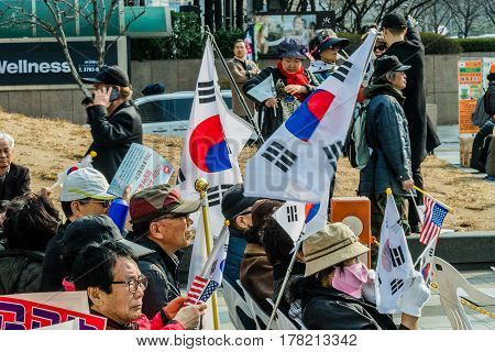SEOUL South Korea March 182017: Protesters gather at a rally in central Seoul to demonstrate against the impeachment of Park Gun Hey