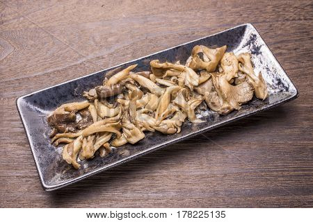 Sauteed mushrooms(Hen of the woods) on a oblong pottery plate