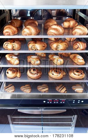 Dessert bread baking in Combi steamer. Production oven at the bakery. Baking bread.