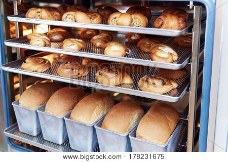 Dessert bread baking in Combi steamer. Production oven at the bakery. Baking bread.