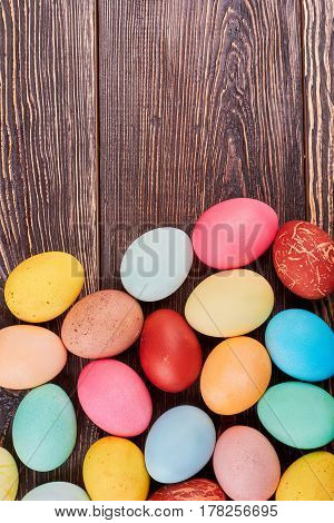 Easter eggs on brown wood. Chicken eggs with copyspace.