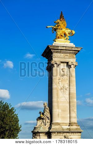 Detail of the Pont Alexandre III, the gilded statue of Fame, Paris, France. This bridge was named after russian Tsar Alexander III.