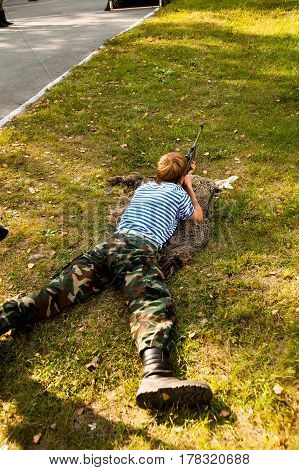 Tyumen, Russia - September 22, 2012: Miles of Fire festival of live history on basis of Avanpost center. Young man took aim with air gun