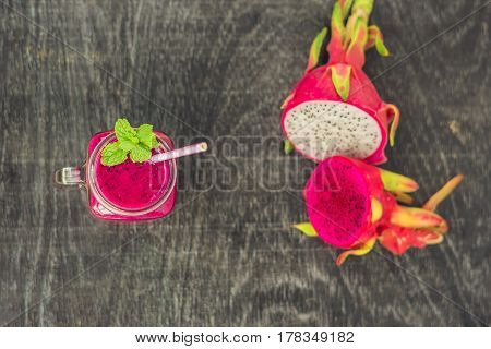 Smoothies Of A Red Organic Dragon Fruit On An Old Wooden Background