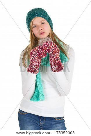Young girl with white shirt beanie and wooly gloves eating gingerbread isolated on white background