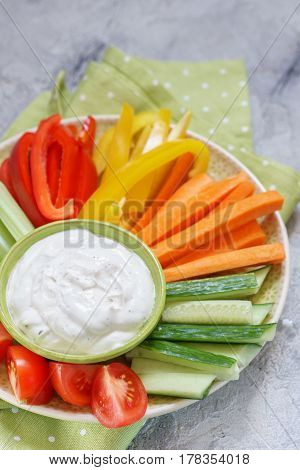 Platter of assorted fresh vegetables with ranch dip