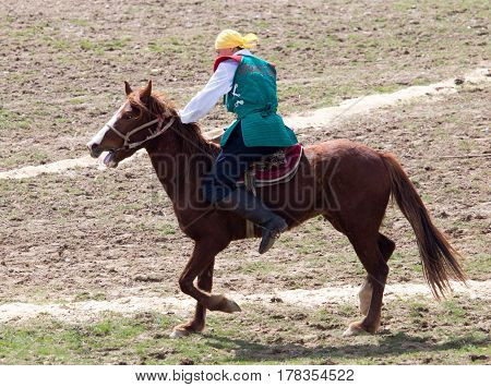 Shymkent, KAZAKHSTAN - 22 March 2017: Celebration of the Kazakh holiday NARIYZ. Competitions on horses .