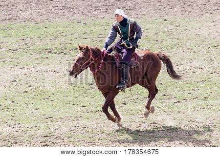 Shymkent, KAZAKHSTAN - 22 March 2017: Celebration of the Kazakh holiday NARIYZ. Competitions on horses .