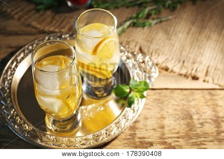 Glasses with delicious wine spritzer on silver tray